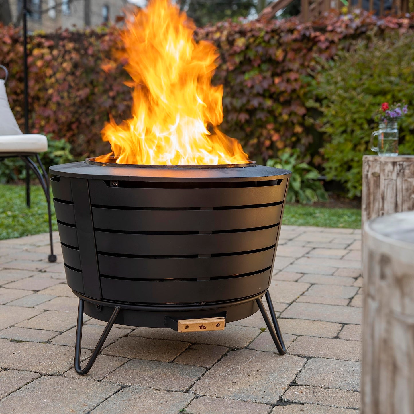 TIKI Brand Smokeless 25 in. Patio Fire Pit, Wood Burning Outdoor Fire Pit - Includes Wood Pack, Modern Design with Removable Ash Pan and Weather Resistant Cover, Black